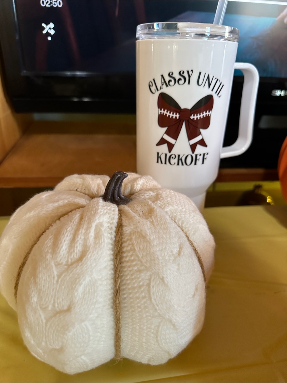 White Football Travel Mug with Cream Knit Decorative Pumpkin